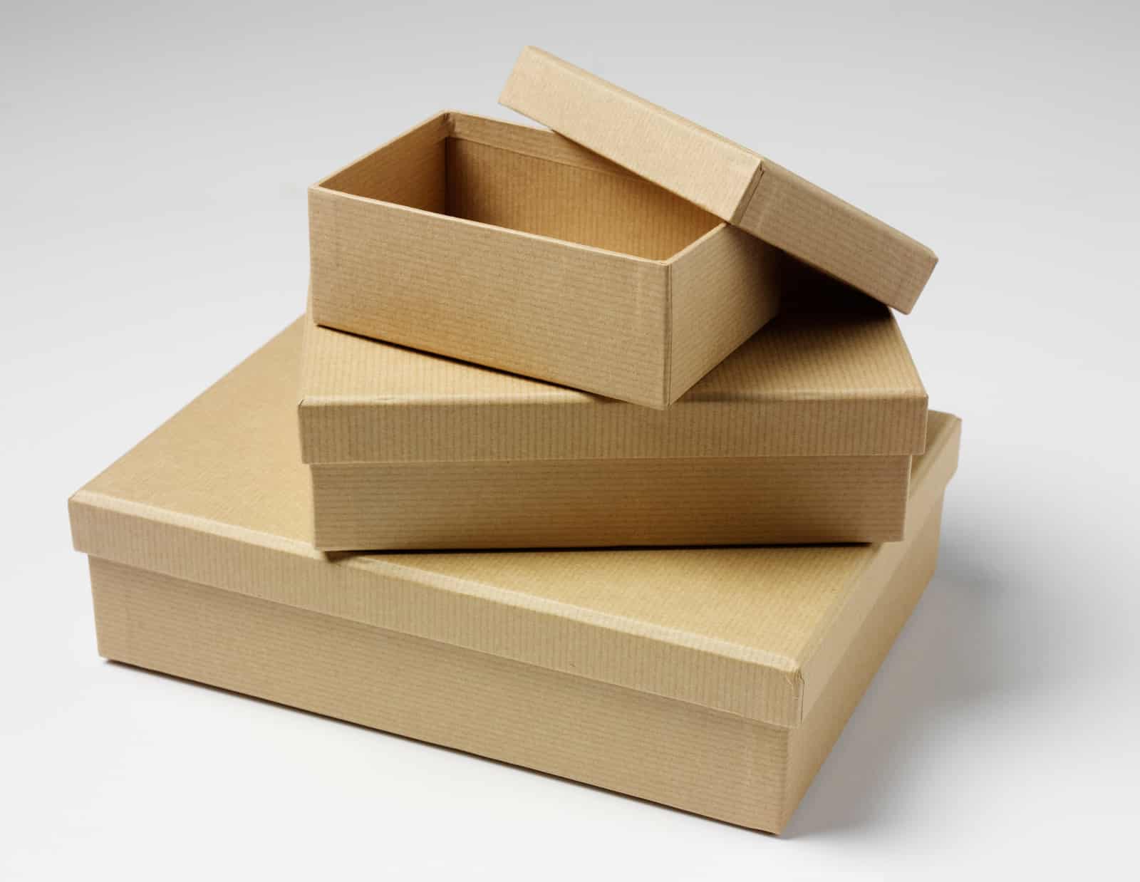 Brown boxes in a pile, with the top one open.